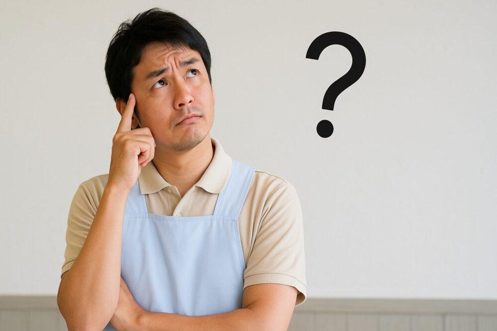 疑問を抱く介護士のイメージ画像